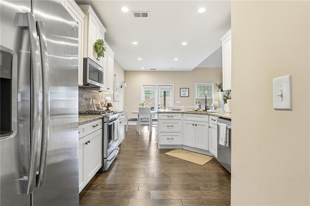266 Cobblestone Trail Dallas, GA 30132 - Photo 6 of 49 a kitchen with stainless steel appliances a refrigerator sink and stove