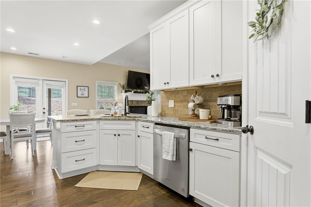266 Cobblestone Trail Dallas, GA 30132 - Photo 7 of 49 a kitchen with stainless steel appliances granite countertop a sink a stove and a refrigerator