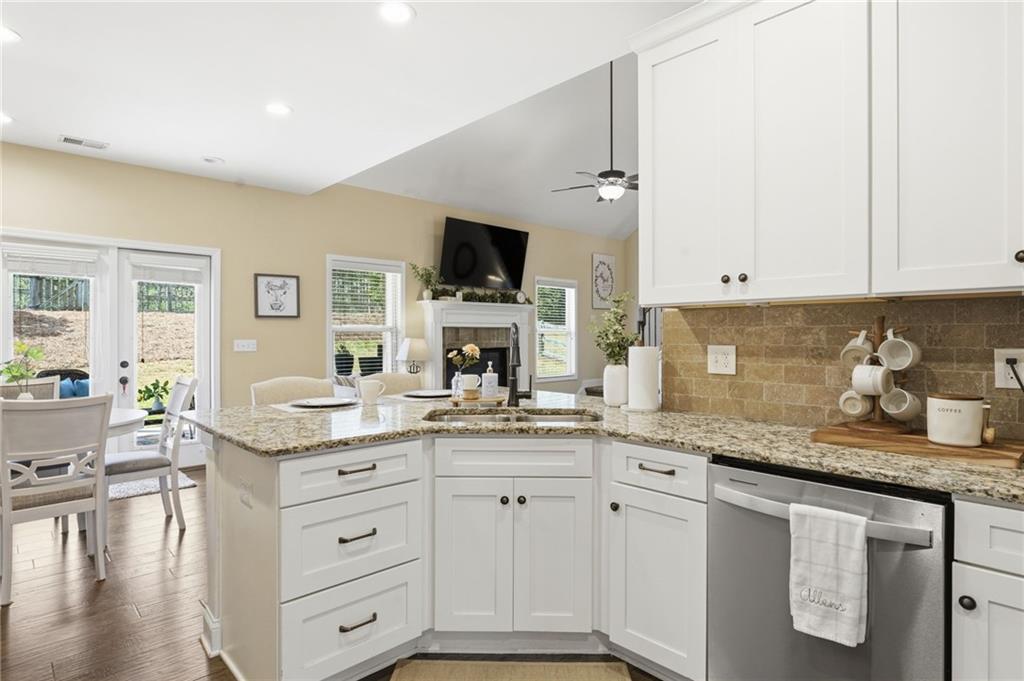 266 Cobblestone Trail Dallas, GA 30132 - Photo 9 of 49 a kitchen with granite countertop a sink and cabinets