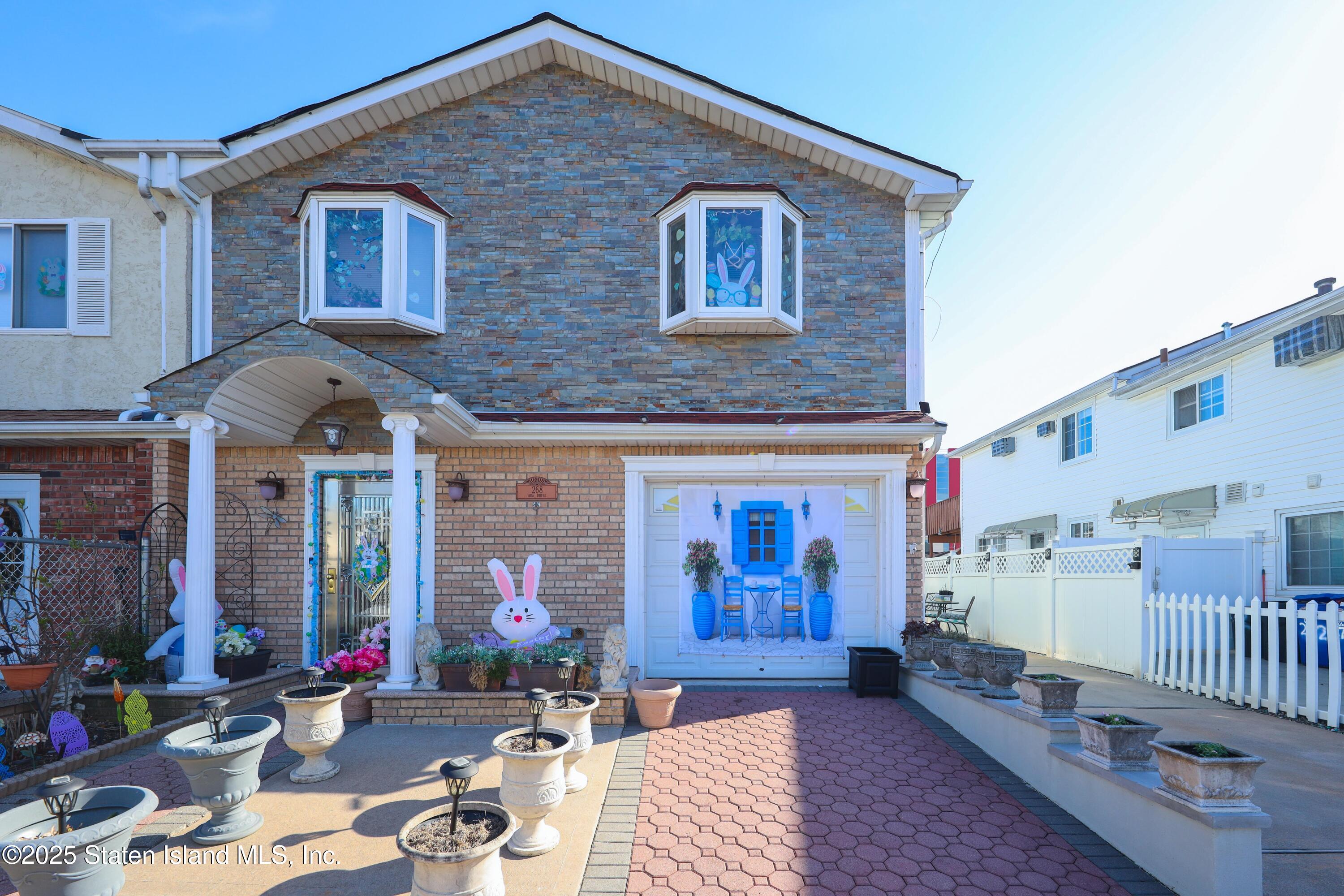 a front view of a house with parking