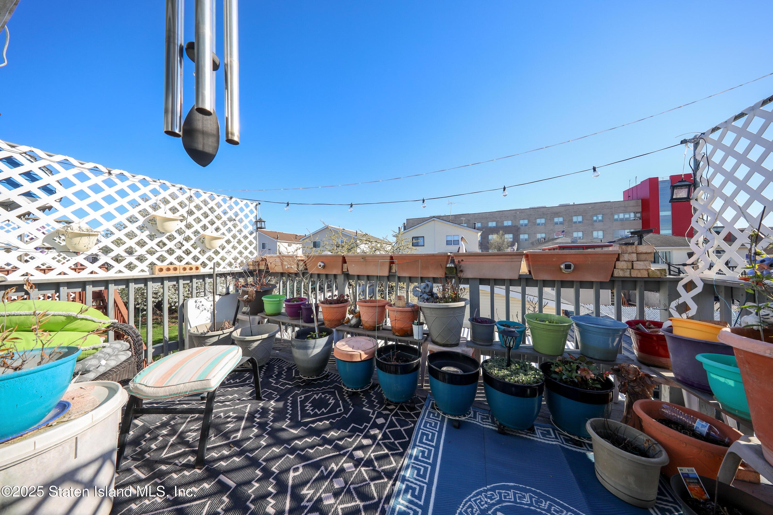 268 Ada Drive Staten Island, NY 10314 - Photo 24 of 27 a view of a chairs and table in patio with a barbeque grill