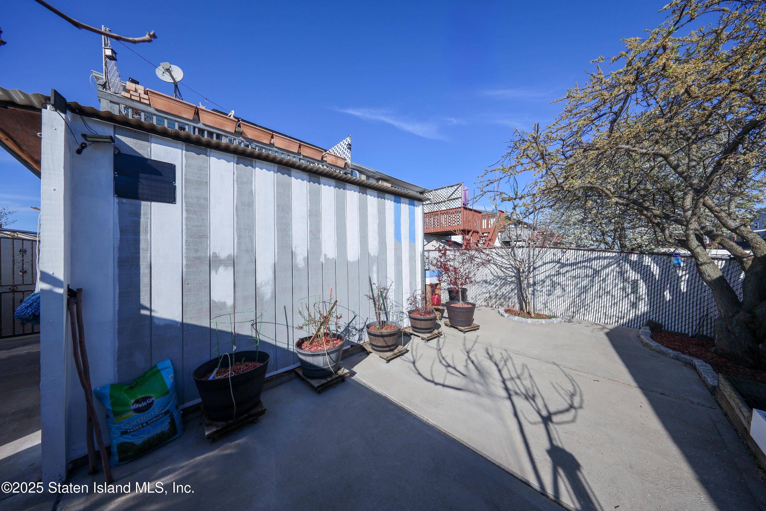 268 Ada Drive Staten Island, NY 10314 - Photo 26 of 27 a couple of cars parked in front of a house