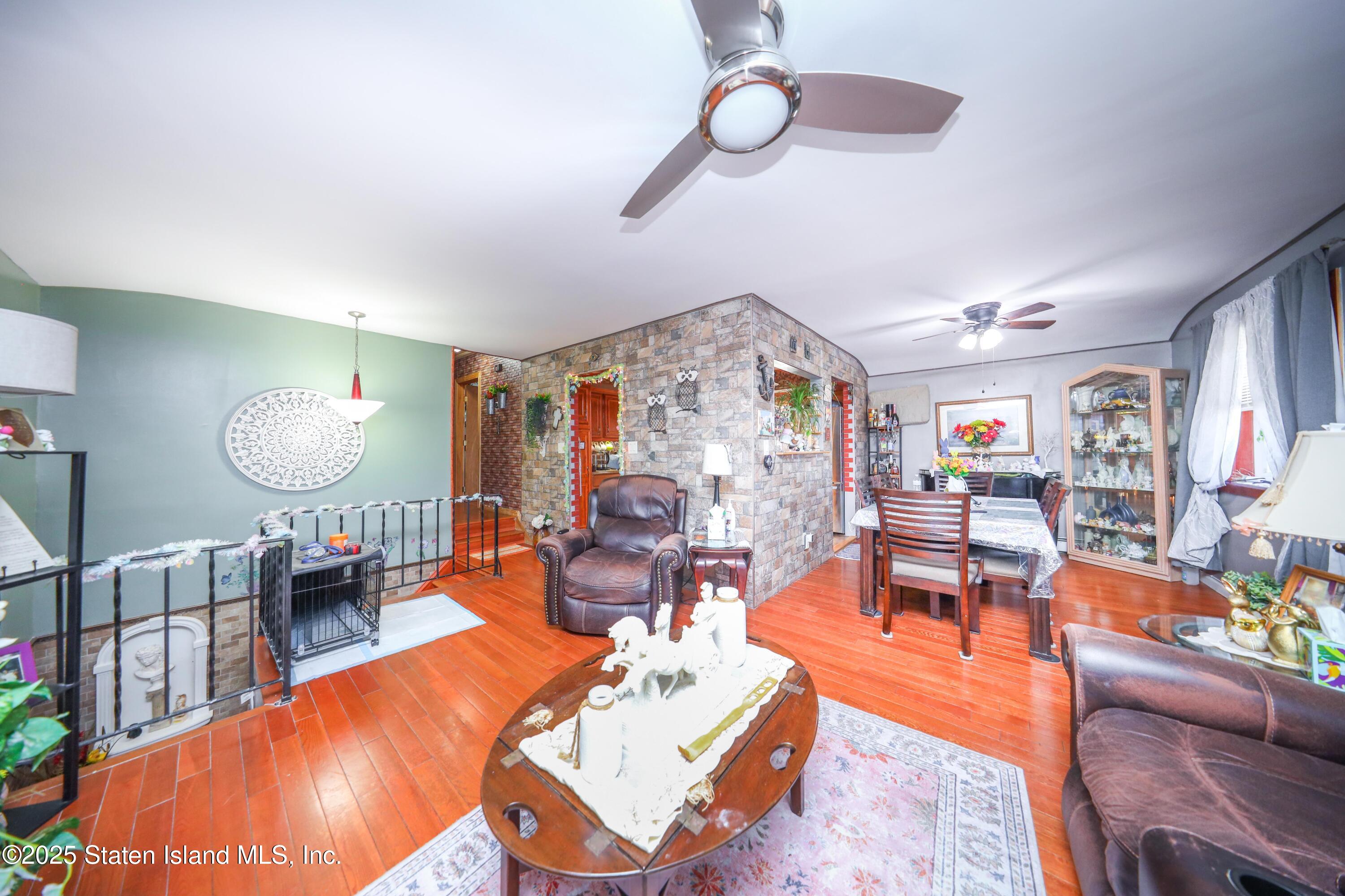 268 Ada Drive Staten Island, NY 10314 - Photo 6 of 27 a living room with fireplace furniture and a large window