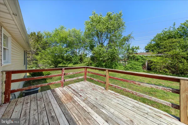 a view of outdoor space with deck and yard