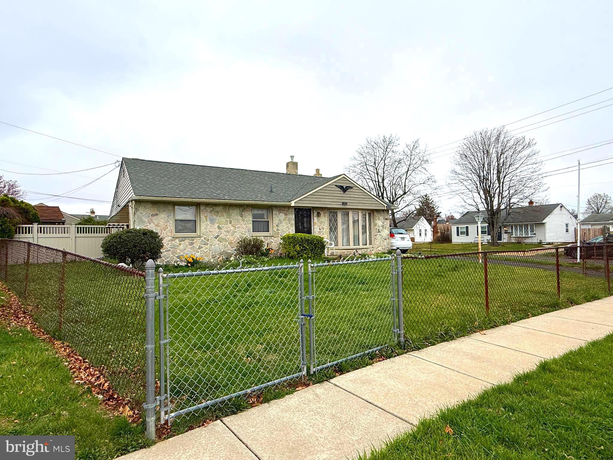 2666 Madara Road Bensalem, PA 19020 - Photo 3 of 16 a view of a house with a big yard and potted plants