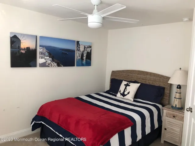 a bedroom with a bed and dresser