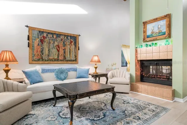 a living room with furniture and a fireplace