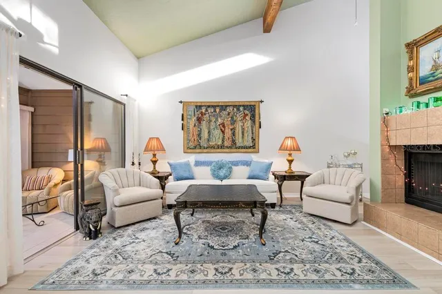 a living room with furniture and a fireplace