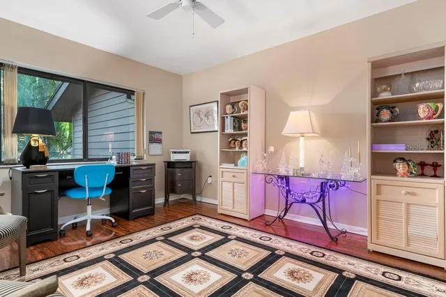 a living room with furniture a rug and a window