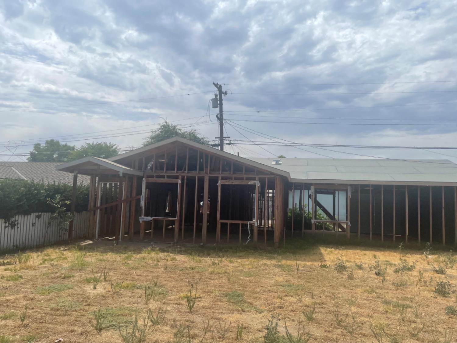 828 Cutting Street Madera, CA 93638 - Photo 2 of 8 a front view of house with yard