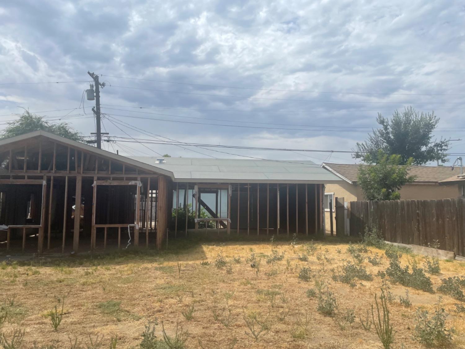 828 Cutting Street Madera, CA 93638 - Photo 4 of 8 a view of a house with backyard porch and sitting area