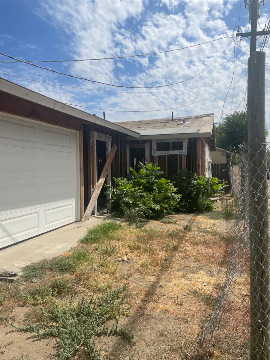 828 Cutting Street Madera, CA 93638 - Photo 8 of 8 a view of a house with backyard and plants