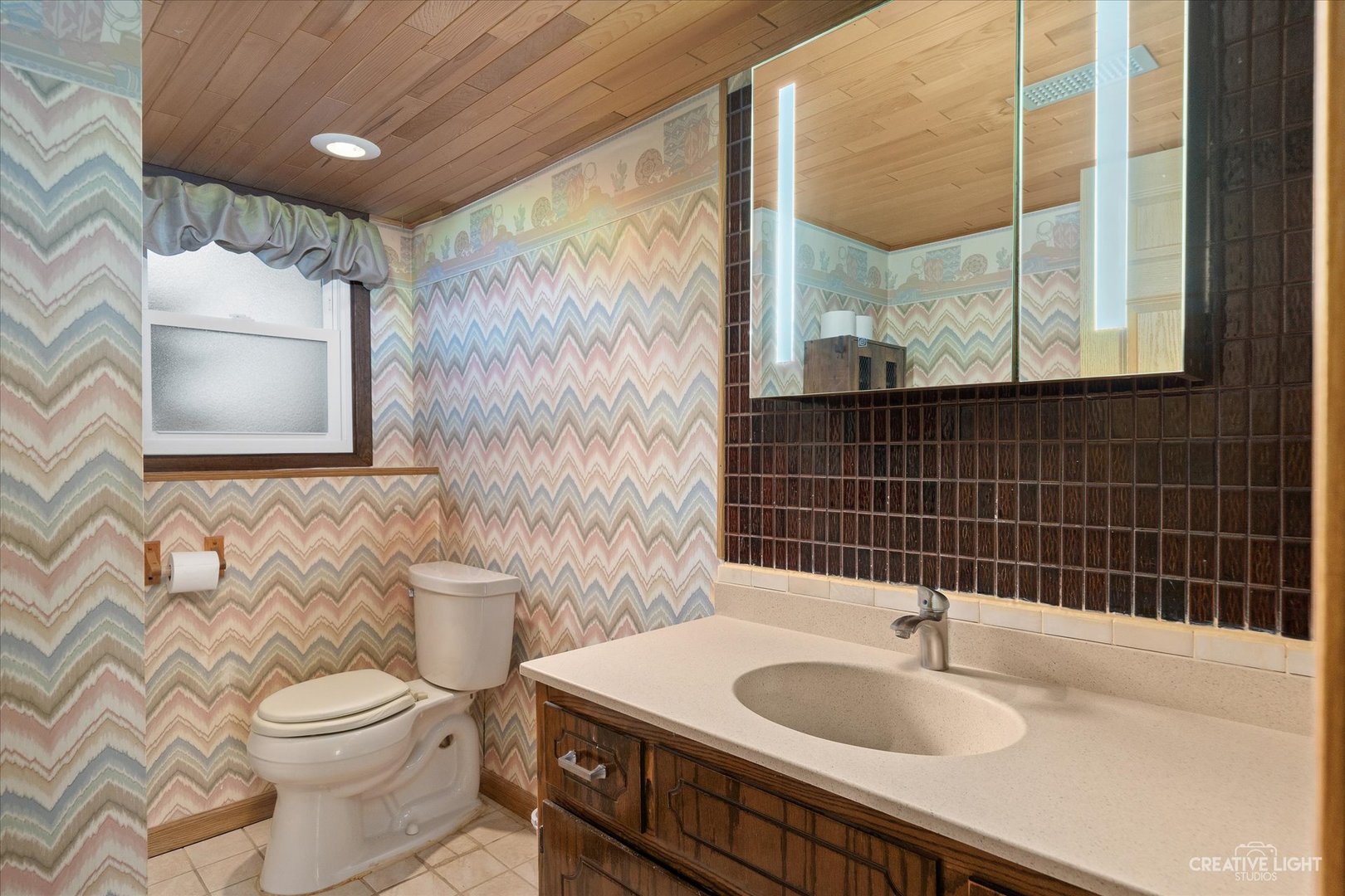 28W758 Wagner Road Naperville, IL 60564 - Photo 13 of 22 a bathroom with a sink a toilet and shower