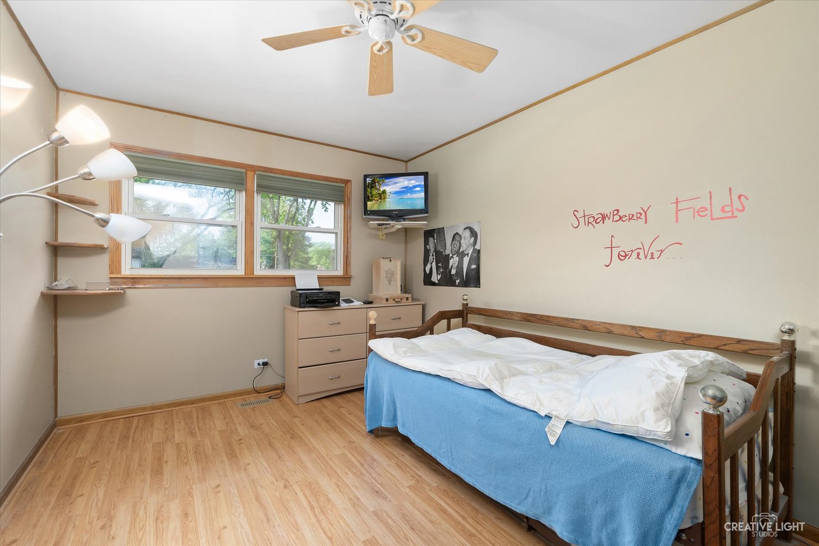 28W758 Wagner Road Naperville, IL 60564 - Photo 9 of 22 a bedroom with a bed and a chandelier