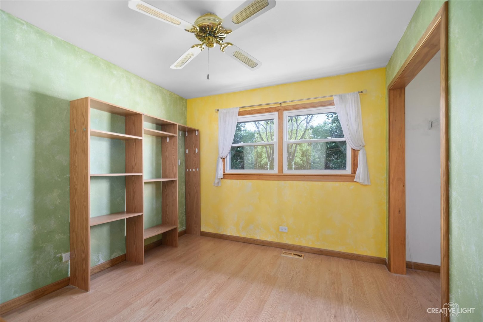 28W758 Wagner Road Naperville, IL 60564 - Photo 10 of 22 a view of an empty room with a window and wooden floor