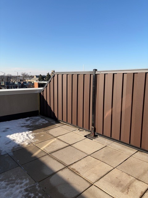 625 Deerfield Road, Unit 419 Deerfield, IL 60015 - Photo 11 of 19 a view of a terrace with a wooden fence