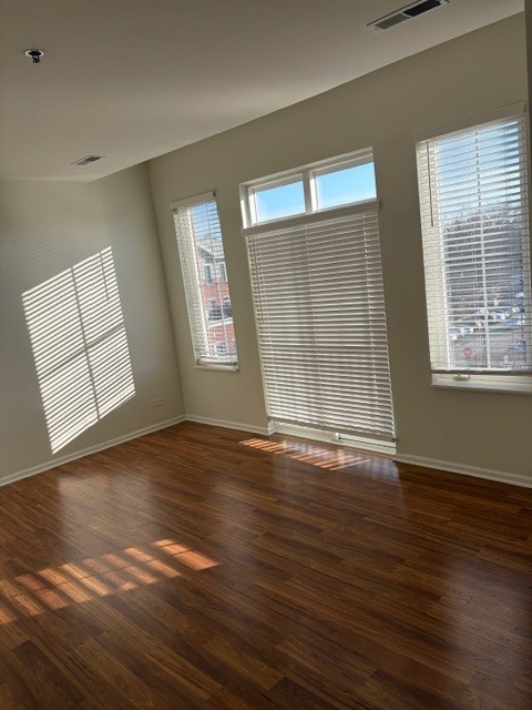 625 Deerfield Road, Unit 419 Deerfield, IL 60015 - Photo 13 of 19 a view of an empty room with wooden floor and a window