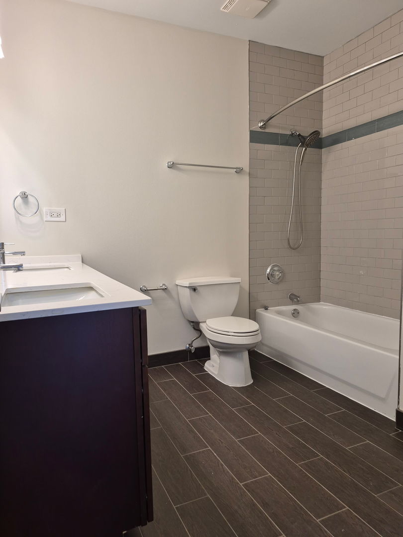 625 Deerfield Road, Unit 419 Deerfield, IL 60015 - Photo 15 of 19 a bathroom with a sink a toilet and shower