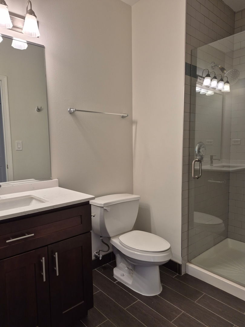625 Deerfield Road, Unit 419 Deerfield, IL 60015 - Photo 16 of 19 a bathroom with a toilet a sink and shower