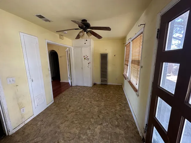 a view of a hallway with windows