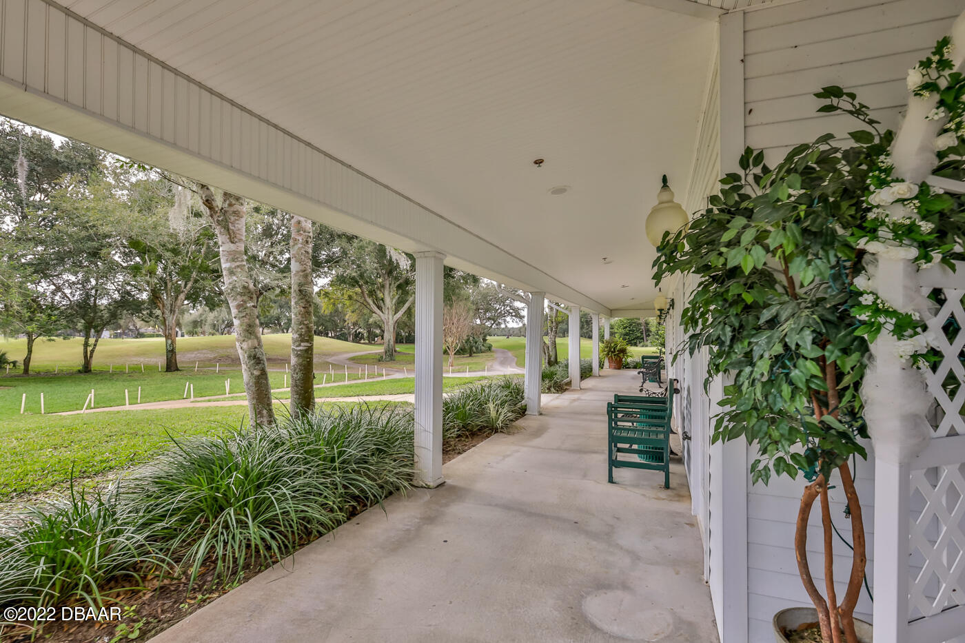 1464 Kinnard Circle Ormond Beach, FL 32174 - Photo 13 of 18 a view of a garden with an outdoor seating