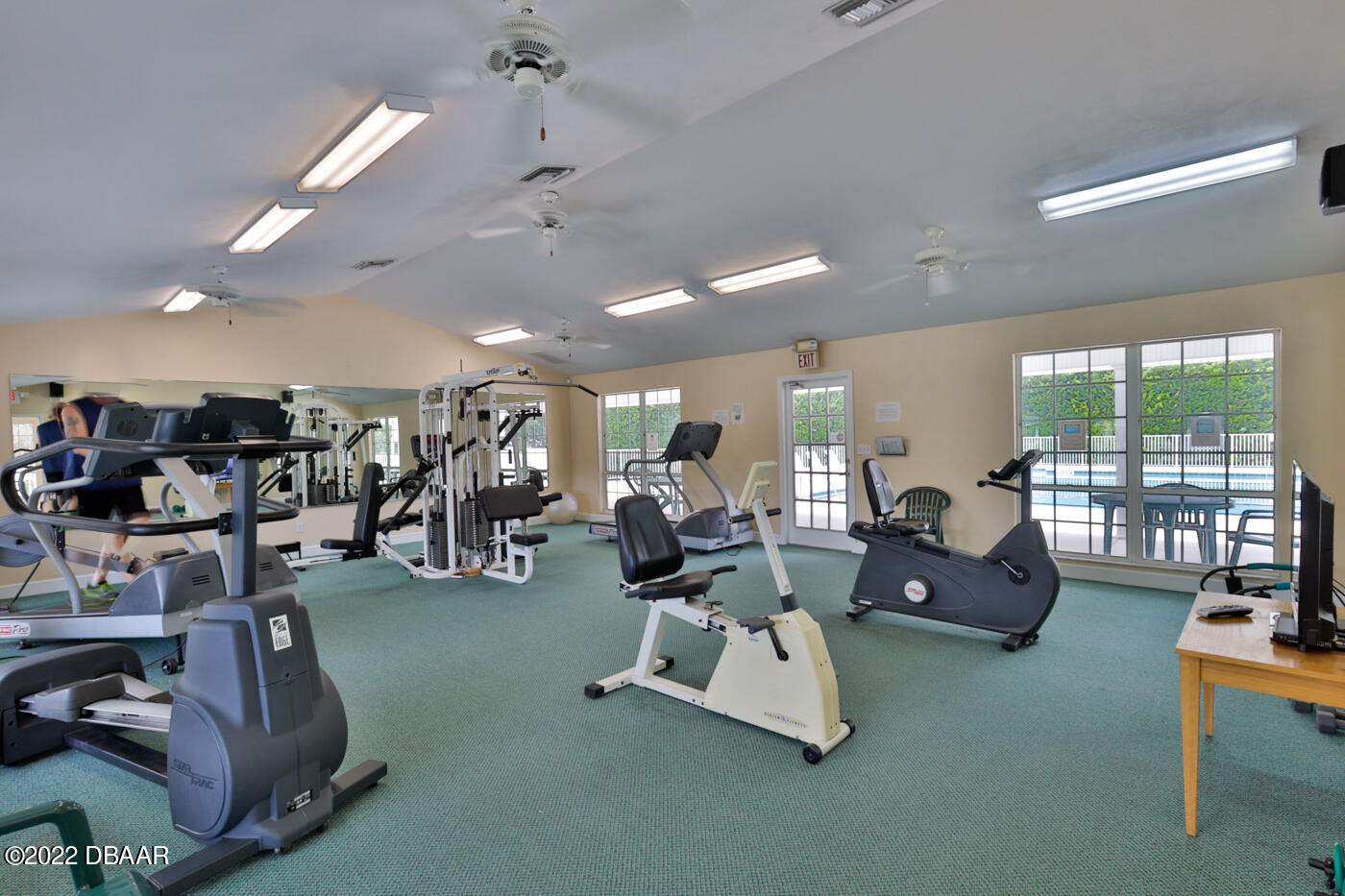 1464 Kinnard Circle Ormond Beach, FL 32174 - Photo 16 of 18 a room with gym equipment and a large window
