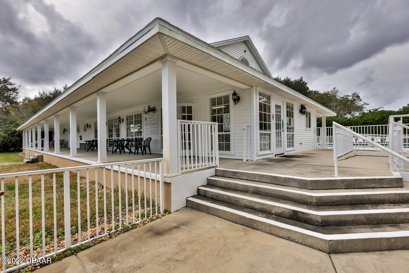 1464 Kinnard Circle Ormond Beach, FL 32174 - Photo 18 of 18 a view of a house with a small deck