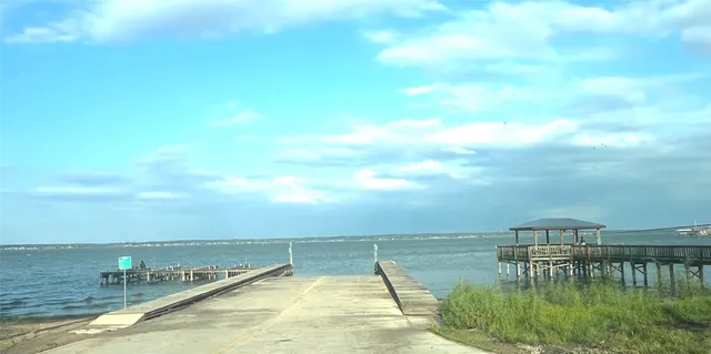 a view of swimming pool with outdoor seating and yard in back