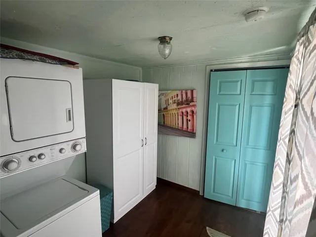 a view of a utility room with closet and windows