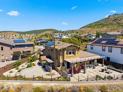 an aerial view of a house with a mountain view