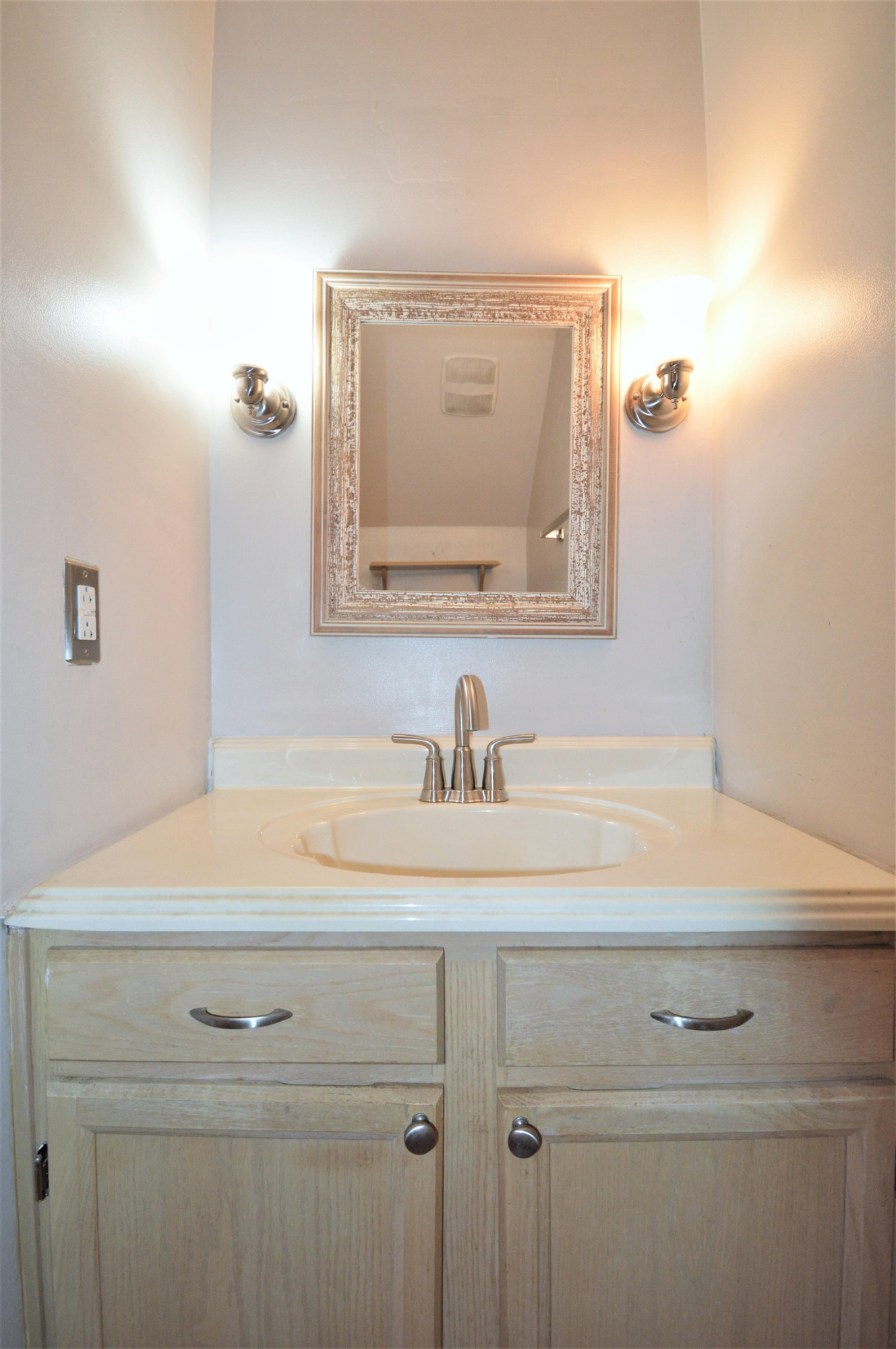4965 Royal Adelaide Way Raleigh, NC 27604 - Photo 12 of 41 The powder room has a new toilet installed in 2022. It also has some extra shelving. Powder Room
