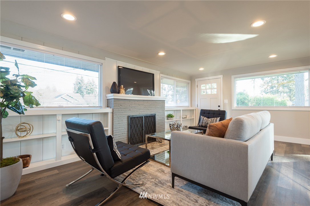 8718 Custer Road Southwest Lakewood, WA 98499 - Photo 14 of 26 a living room with furniture fireplace and a large window
