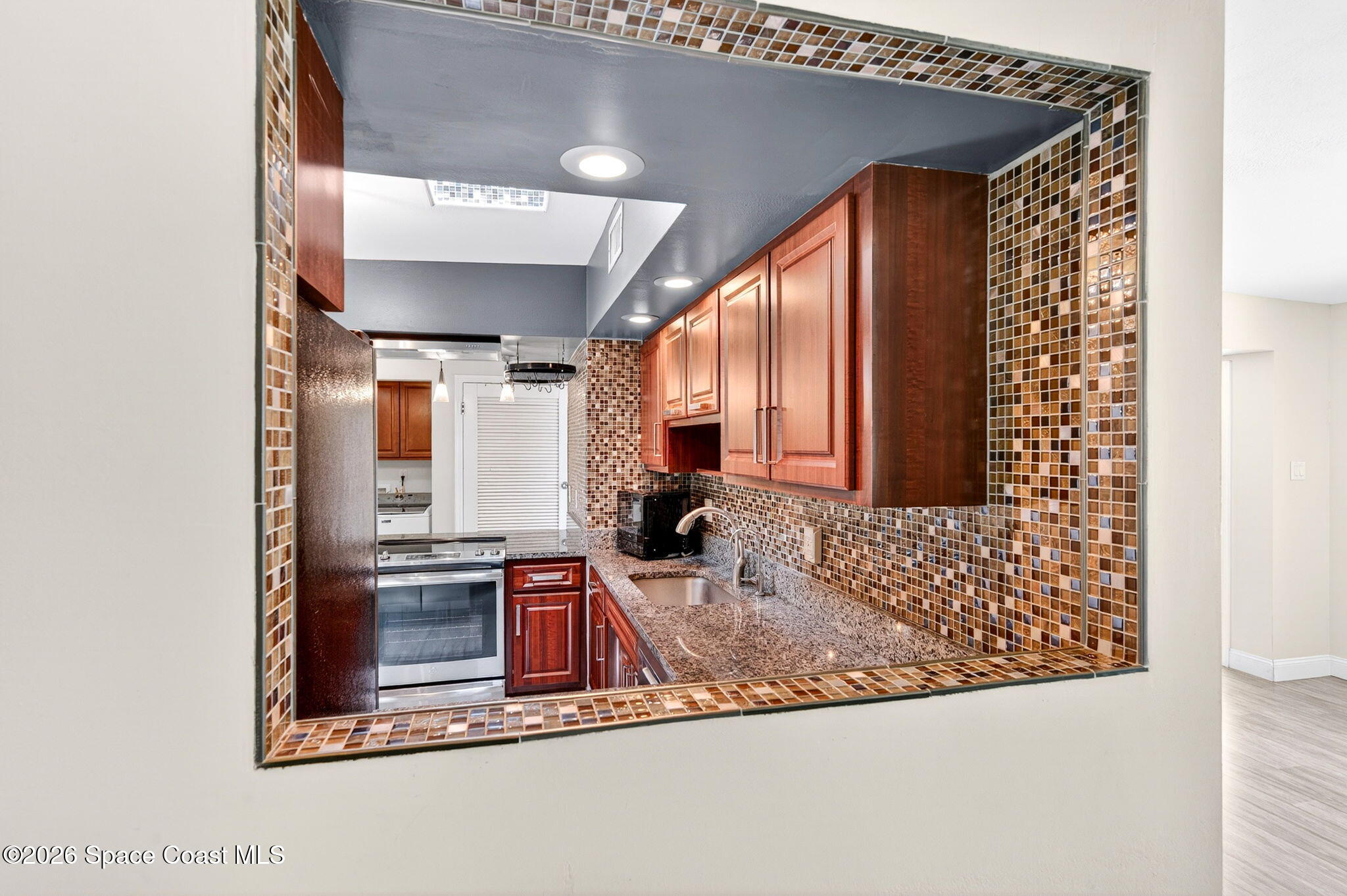 713 James Circle Palm Bay, FL 32905 - Photo 23 of 53 Kitchen Pass Thru
