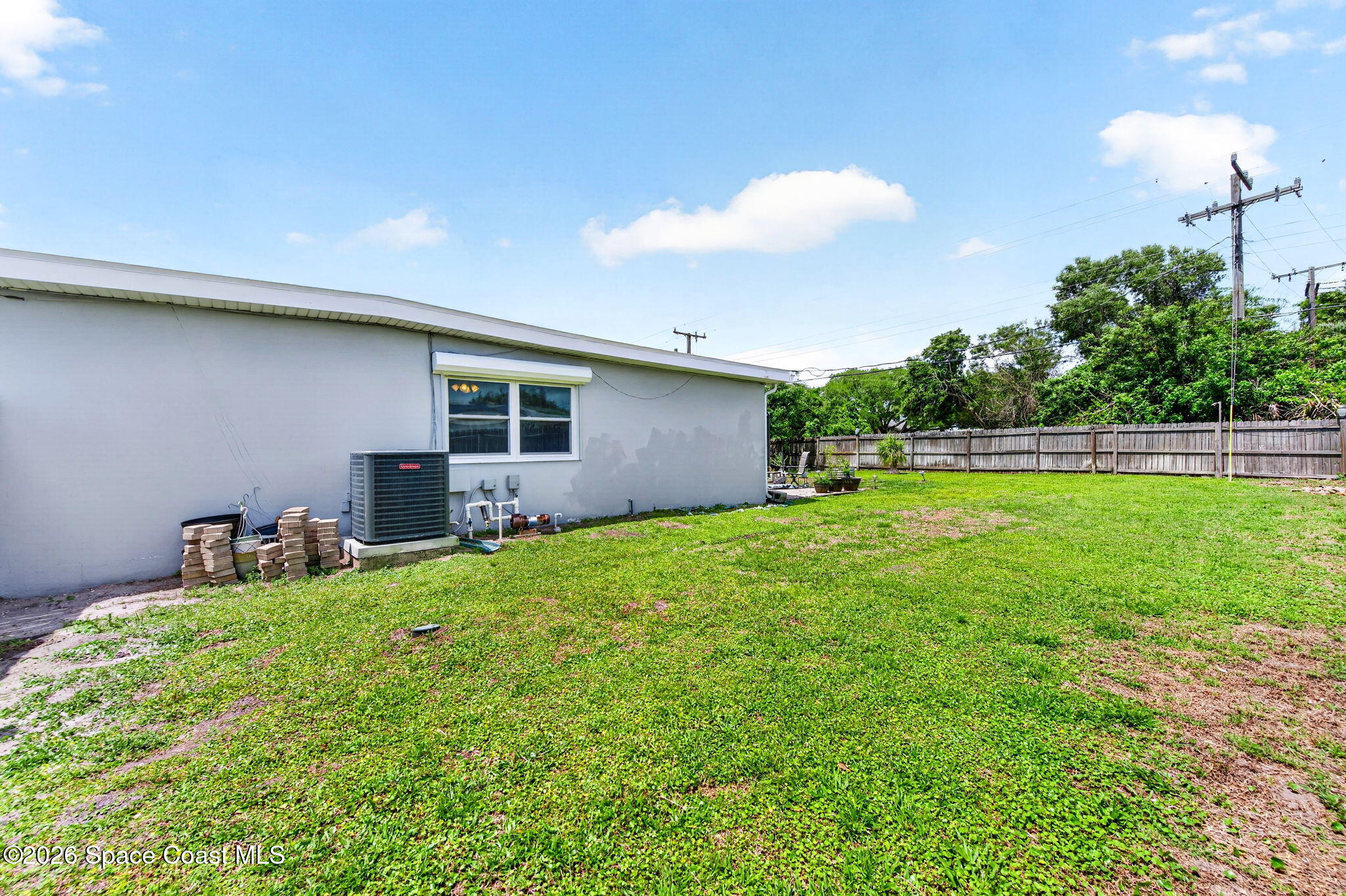713 James Circle Palm Bay, FL 32905 - Photo 41 of 53 Corner Backyard View
