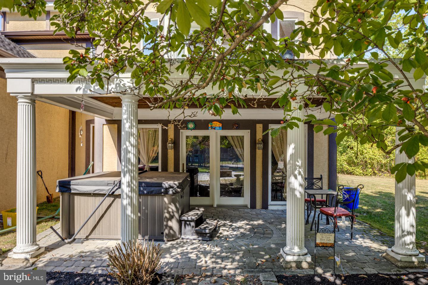 740 Garwood Road Moorestown, NJ 08057 - Photo 31 of 41 Charming patio with hot tub and lush greenery.