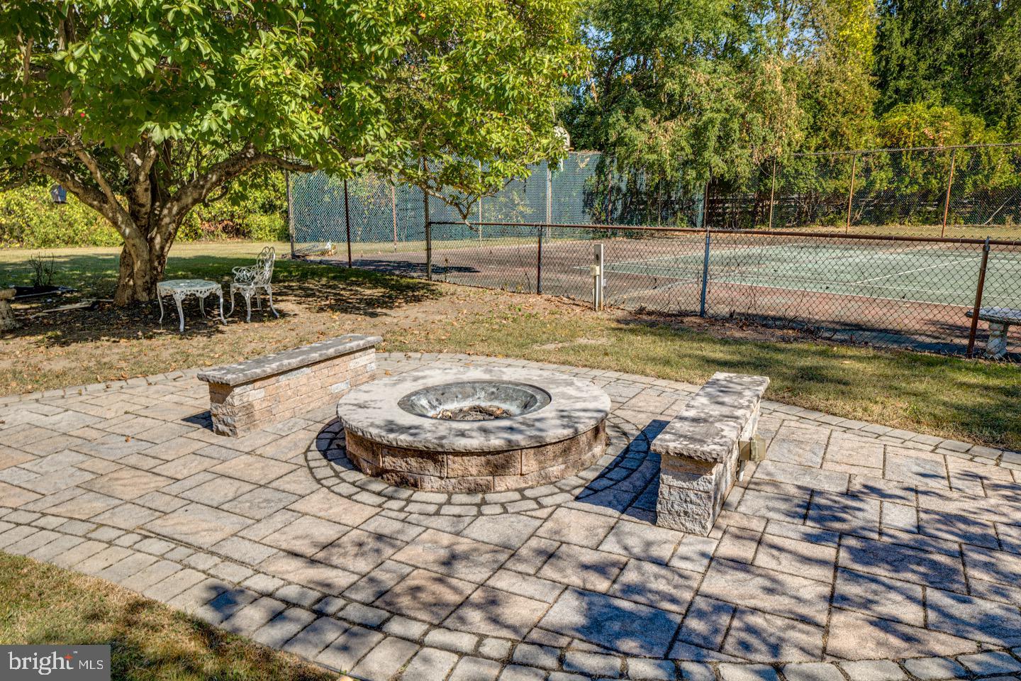 740 Garwood Road Moorestown, NJ 08057 - Photo 32 of 41 Cozy fire pit area amidst lush greenery.