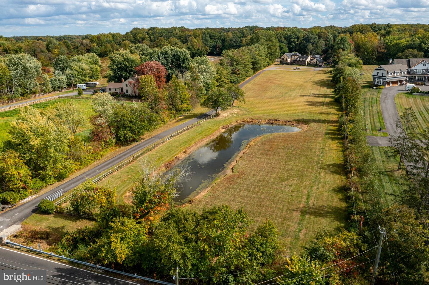 740 Garwood Road Moorestown, NJ 08057 - Photo 38 of 41 Serene landscape with pond and lush greenery.