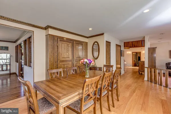 a view of a dining room with furniture and chandelier
