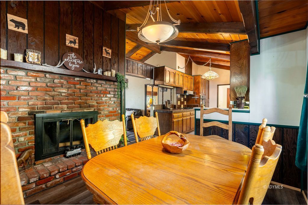 25580 Fir Street Idyllwild, CA 92549 - Photo 13 of 48 a view of a dining room with furniture and chandelier