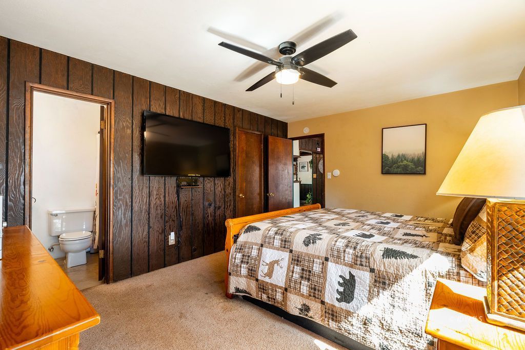 25580 Fir Street Idyllwild, CA 92549 - Photo 22 of 48 a bedroom with a bed and a flat screen tv