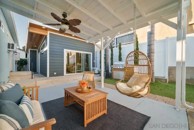a view of a livingroom with furniture and a window