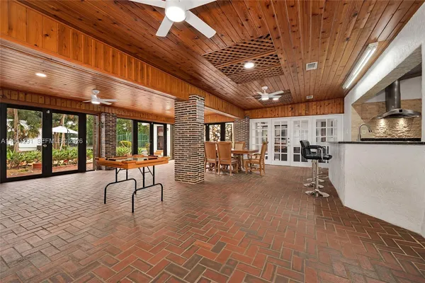 a view of a entryway with table and chairs