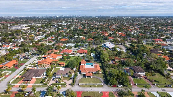 a view of a house with a yard and sitting area