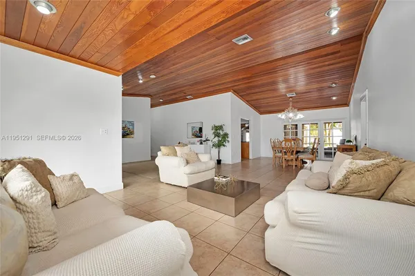 a living room with furniture and a table