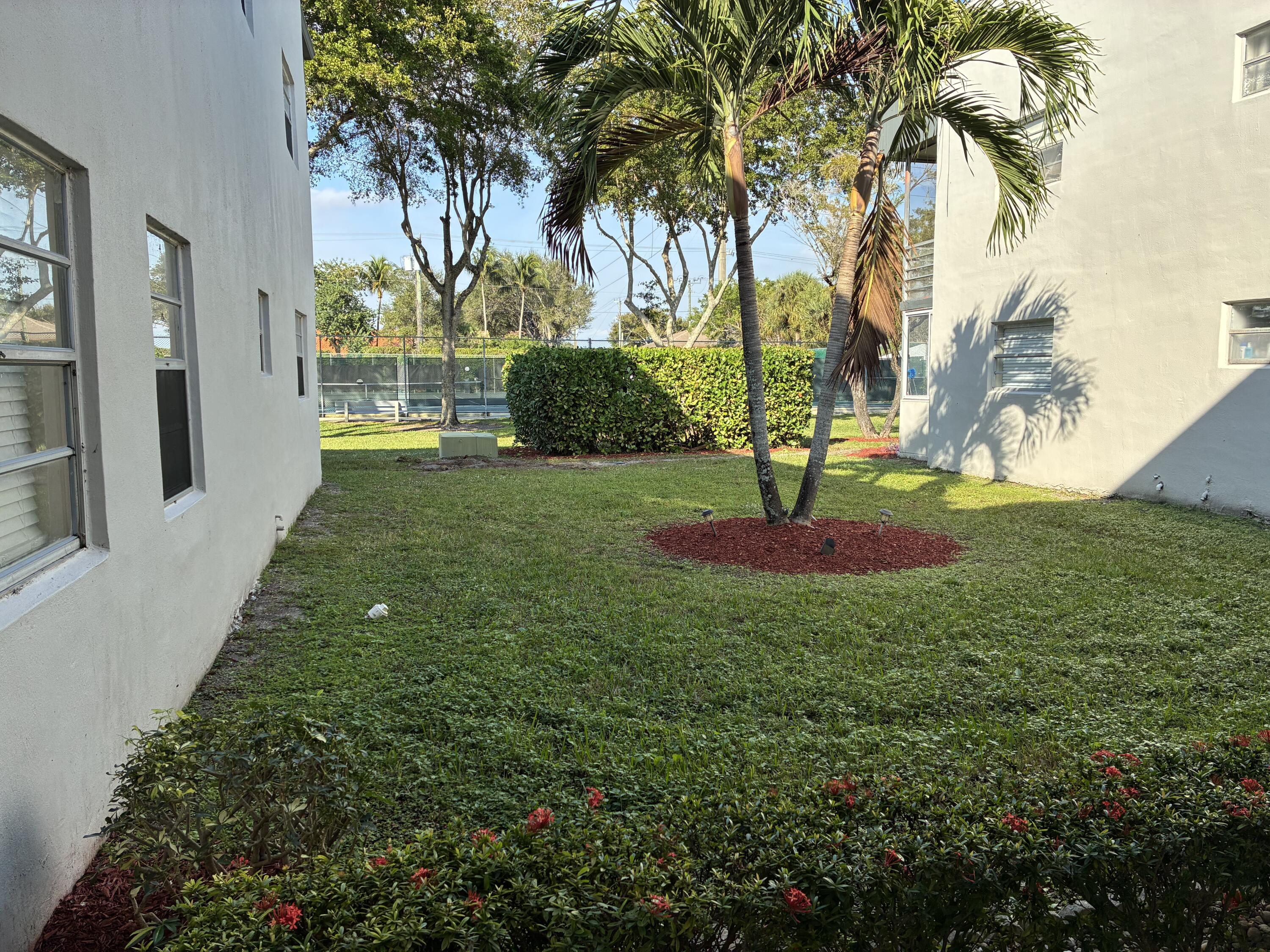 355 Normandy Lane Delray Beach, FL 33484 - Photo 1 of 33 a view of a garden