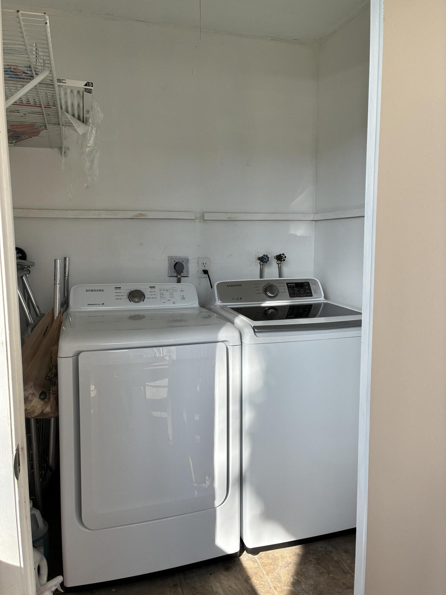 355 Normandy Lane Delray Beach, FL 33484 - Photo 6 of 33 a utility room with dryer and washer