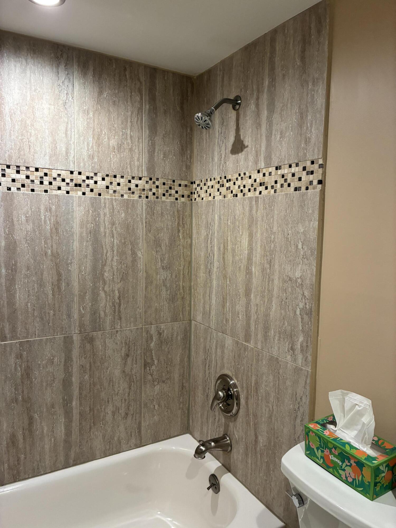 355 Normandy Lane Delray Beach, FL 33484 - Photo 8 of 33 a bathroom with a sink and a shower curtain