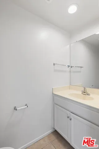 a bathroom with a sink and vanity