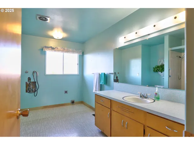a bathroom with a sink and mirror