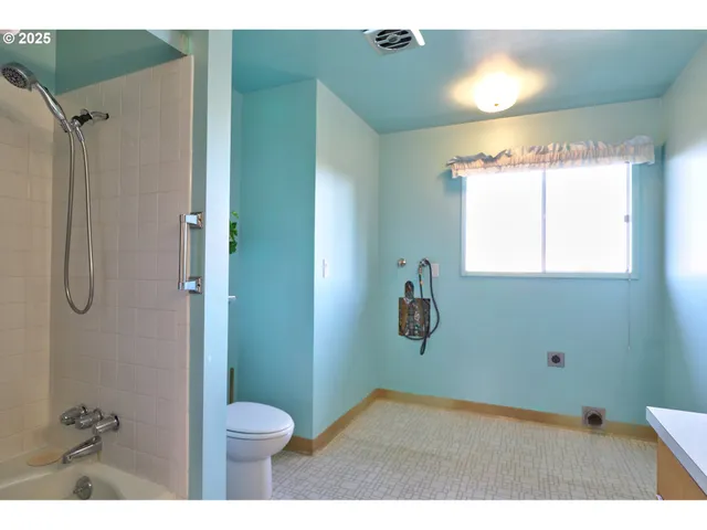 a bathroom with a toilet and a sink